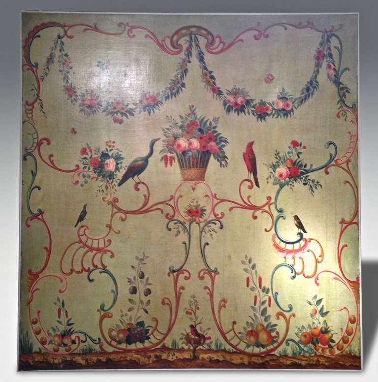 A rare and extremely decorative french painted panel (third quarter of the 18 th century). On a soft green painted ground the panel depicts a 'riot' of flowers birds and foliage within a frame of rococo scrolls (cleaned and relined)