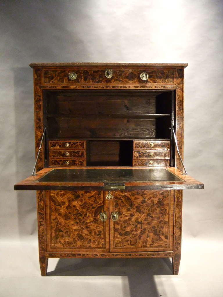 Louis XVI oyster marquetry secrétaire cross banded in King wood and Tulip wood with fitted interior and very rare Porphyry marble top.
