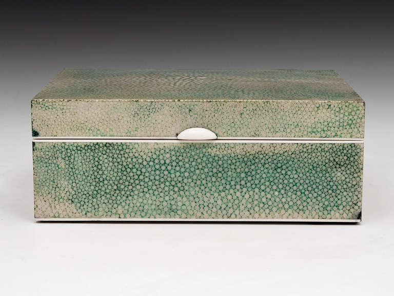 Art Deco Shagreen Cigarette box with Ivory finger plate, Satin Birch interior with sliding divider.

Shagreen is a leather made from sharkskin or the skin of a Stingray. This type of Shagreen was first made popular by Jean-Claude Galluchat (d1774)