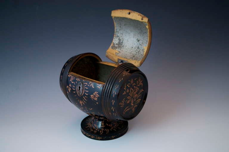 Chinoiserie Barrel Tea Caddy, circa 1800 

Very rare Caddy in the shape of a Wine barrel ebonised and simply painted in a European interpretation of Chinese figures with a floral decoration standing on a turned ebonised & painted base. The