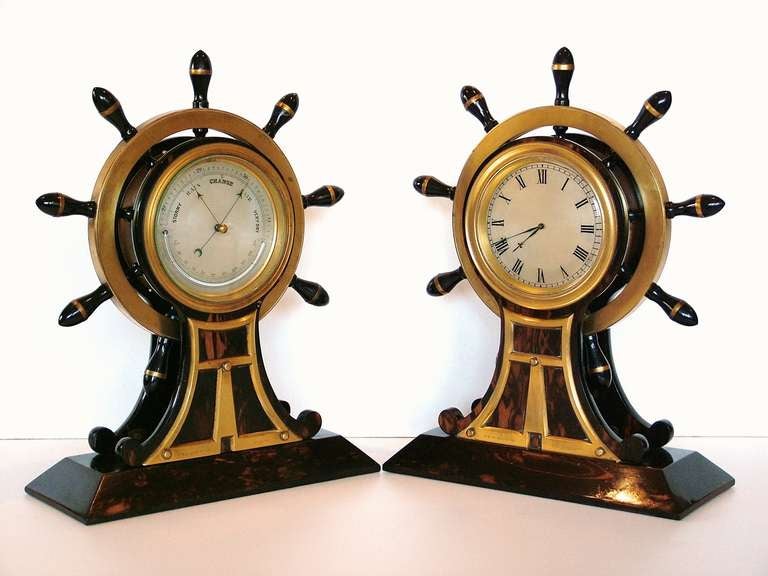 A striking pair of ship's wheels clock & aneroid barometer constructed from coromandel and wonderfully gilded brass. 

This pair of Ship's Wheels are of stunning quality & design, the pair comprises of a Mantel clock and an Aneroid barometer, both