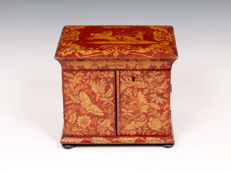Exquisite Red Lacquer Penwork Sewing Cabinet.

This wonderful little sewing cabinet with red ground penwork decoration has a a pair of greek pegasus horses pulling a chariot manned by Zeus the sky of gods, surrounded by symmetrical pattern of