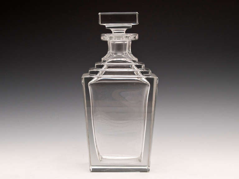Art Deco crystal cut glass Decanter featuring a striking step shoulder design with square stopper.

More information on Decanters can be found on our history page.