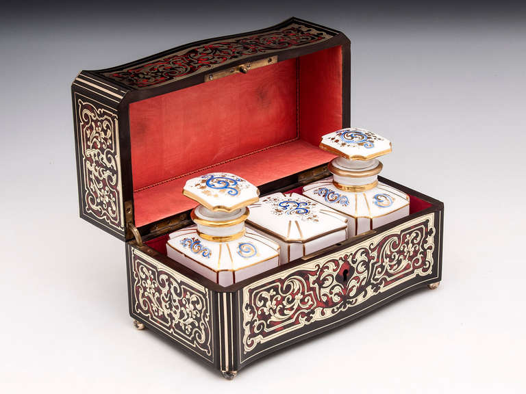 Wonderful boulle serpentine Tea Caddy with engraved brass and red tortoiseshell, the back is veneered in Ebonised pear wood. The interior is lined with a pale red silk and has its superb removable porcelain Tea Caddies and Sugar container, each one