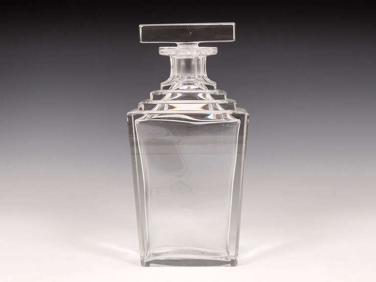 Art Deco crystal cut glass Decanter featuring a striking step shoulder design with T-bar stopper.

Shipping Cost:
United Kingdom £25
Europe £45
International £65