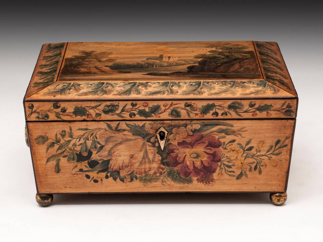 Painted sewing box, all applied on white wood sycamore box with a quite beautiful shape with floral patterns on all sides and a scene with a castle view on the top. 

This wonderful Regency penwork sewing box stands on four brass ball feet and has