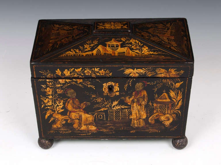 This wonderful Tea Caddy has chinoiserie figures decorating the front of the box. The other faces and lid, are embellished with chinioserie architecture in black and gold giving a striking finish. 

Inside is lined with marble paper instead of tin