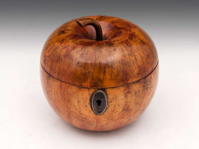 Apple tea Caddy with wonderful red blushing and realistic stalk, has steel lock and escutcheon and has a wonderful patination. The apple tea caddy still has traces of tin lining, comes with a fully working lock and tasseled key.  

Shipping Cost: