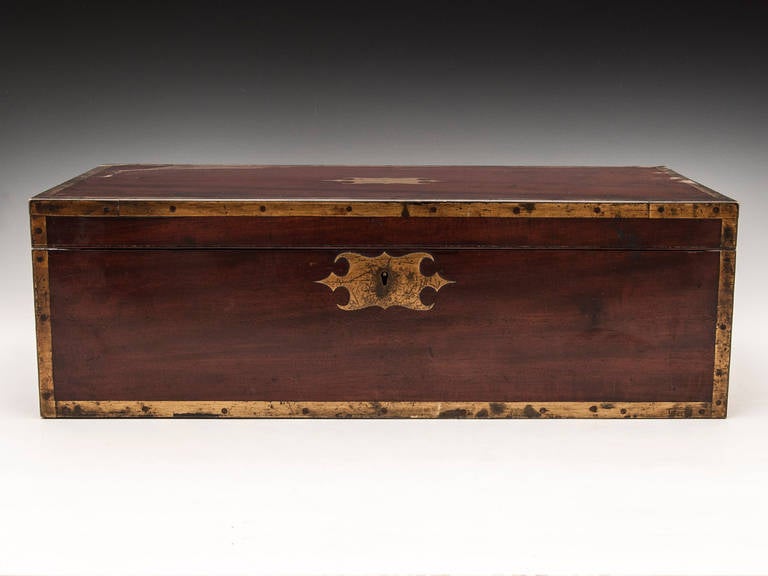 Antique Writing Box made of solid Mahogany bound with square brass and steel screws, has two campaign flush fitting handles either side of the writing box and has a side drawer, all in fantastic original condition and superb patination. The interior