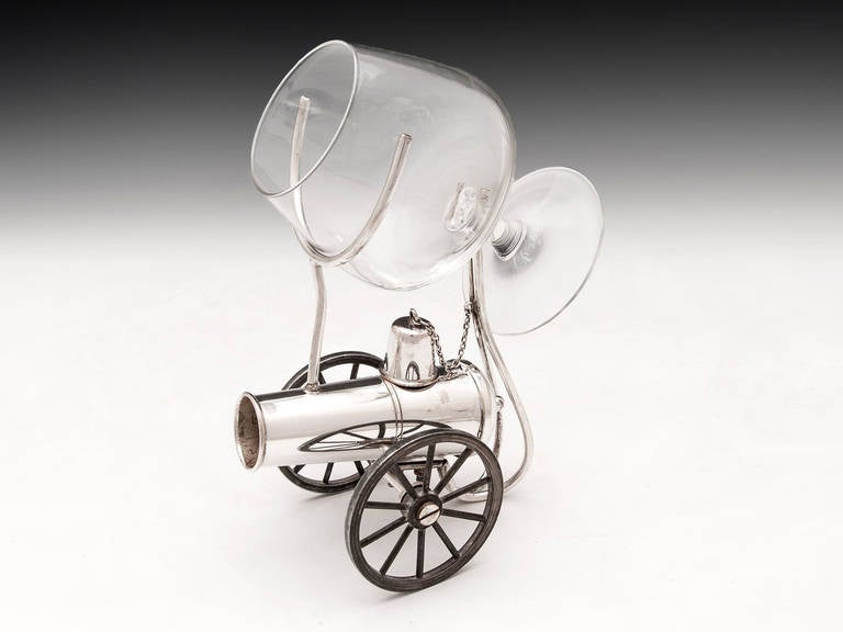 A silver plate brandy warmer in the shape of a canon. Features a bell shaped snuffer with link chain. 

This sale includes the brandy snifter. 

Shipping cost: 
United Kingdom £25. 
Europe £45. 
International £65.