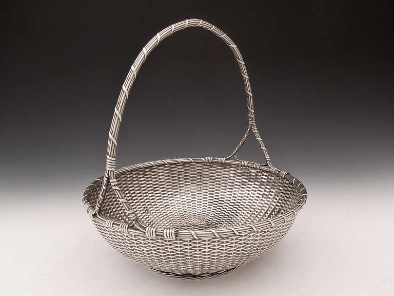 Silver weave basket by renowned french silversmith Christofle with a wonderful intertwined carry handle. 

Chirstofle has been a manufacturer of fine silverware since 1830 after being founded by Charles Christofle, Paris, France and traded until