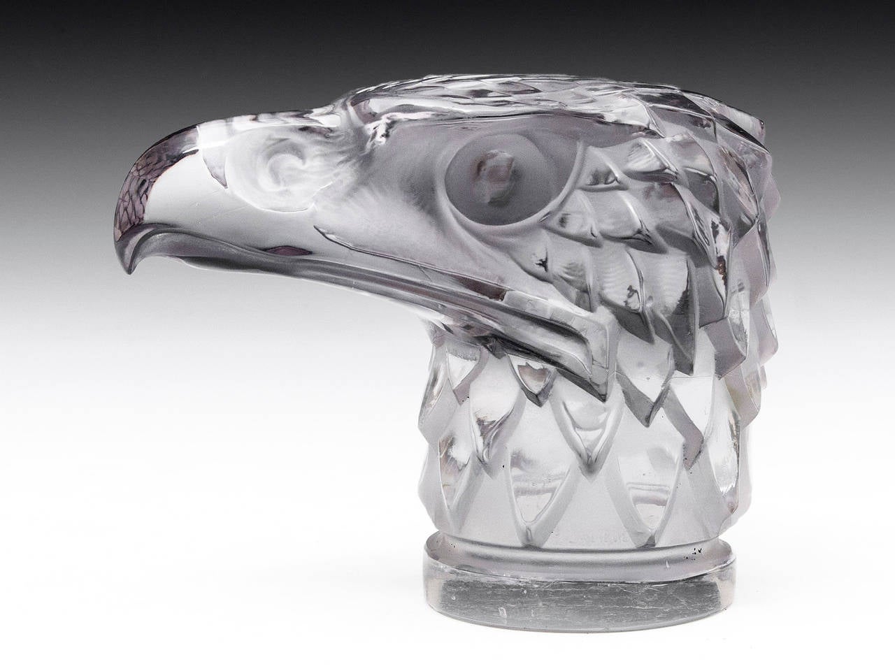 Lalique car mascot in the shape of an eagle head. These were originally made as car hood ornaments in the 1920's by famous glass make René Jules Lalique, who started a company using his own name, which still creates fine glassware today. This eagle
