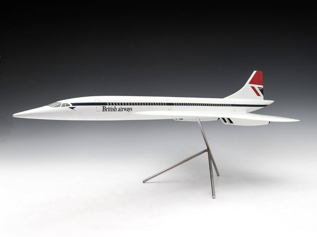 Stunning scale model of a BAC Concorde supersonic airliner complete with stand. 

There is a label on the underside which reads: 
