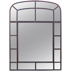 Arched iron framed mirror