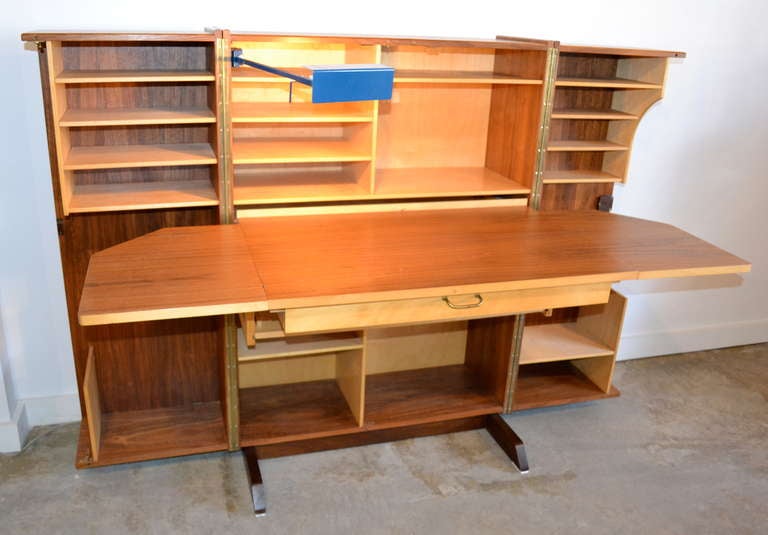 1950's swiss made expendable work space desk, transforms to beautiful walnut cabinet.  working desk lamp.