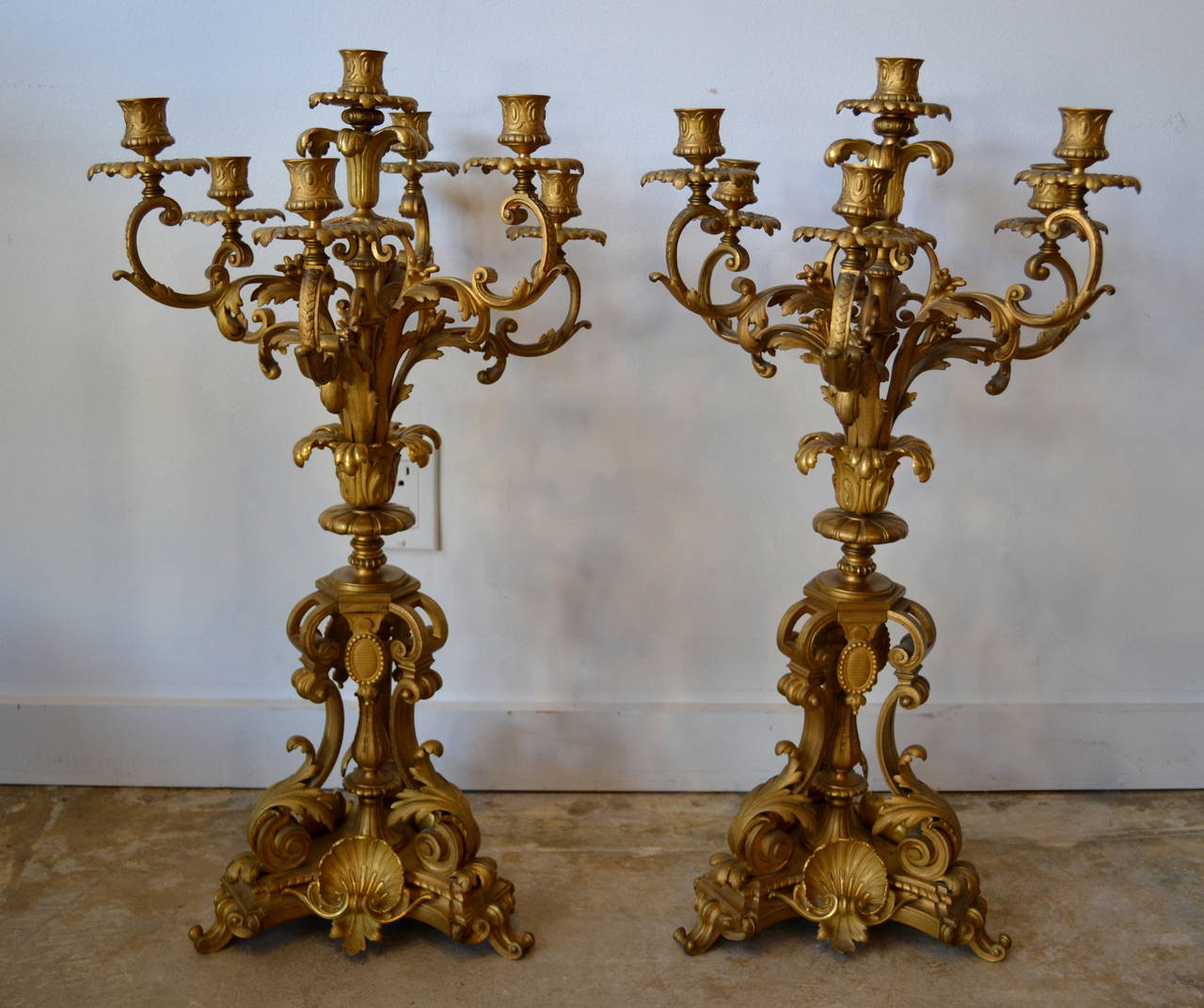 Stunning pair of French fourteen-light gilt bronze candelabras, incredibly ornate with shell, leaf and scroll motif, late 19th century.