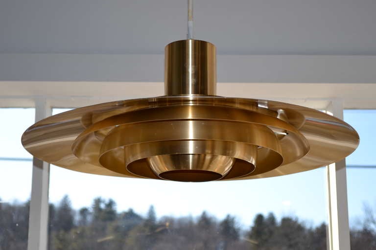 danish pendant light designed by preben fabricius and jorgen kastholm, aluminum base, coated brass.