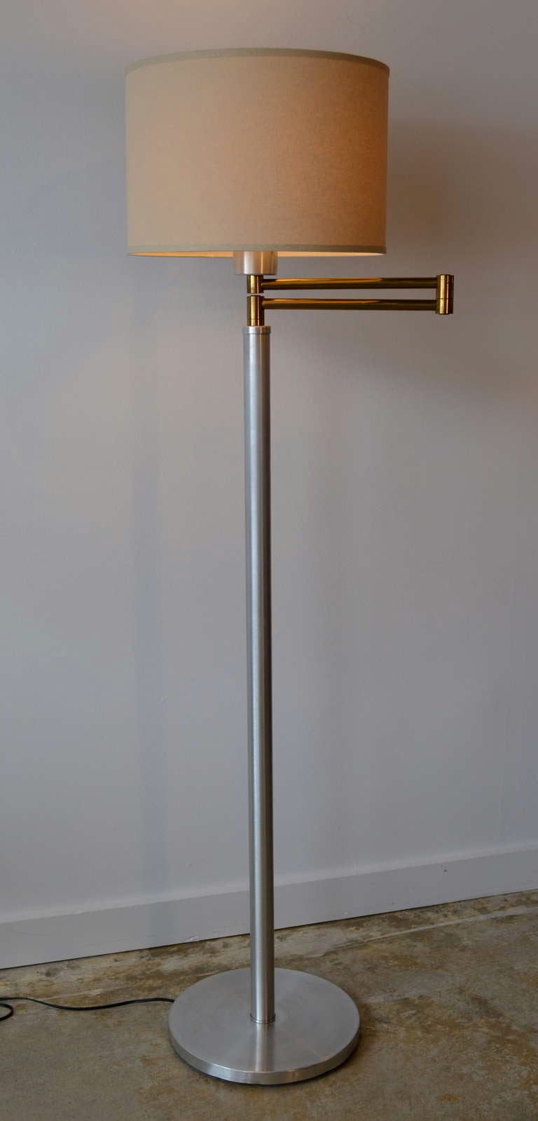 Aluminum and Brass floor lamp in the style of Walter Von Nessen. Rewired. Shade not included. 