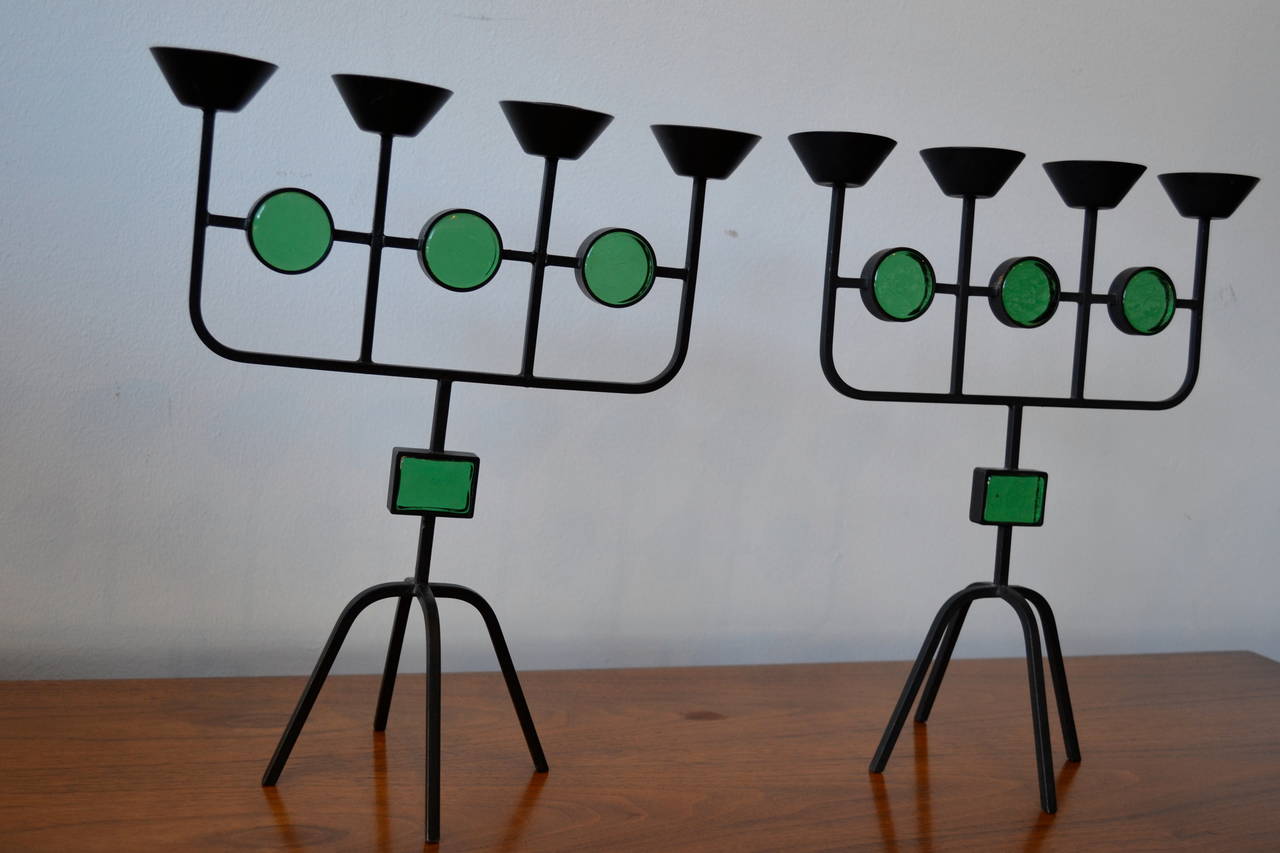 pair of wrought iron and green glass candleholders designed by erik hoglund for ystad, sweden.  both signed.