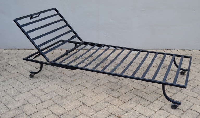 very cool wrought iron lounge chair designed by john good, adjustable reclining back.  poolside or patio