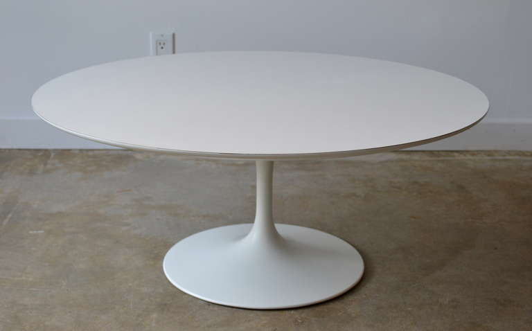 Very early cast iron base coffee table by Eero Saarinen for Knoll, white laminate top.