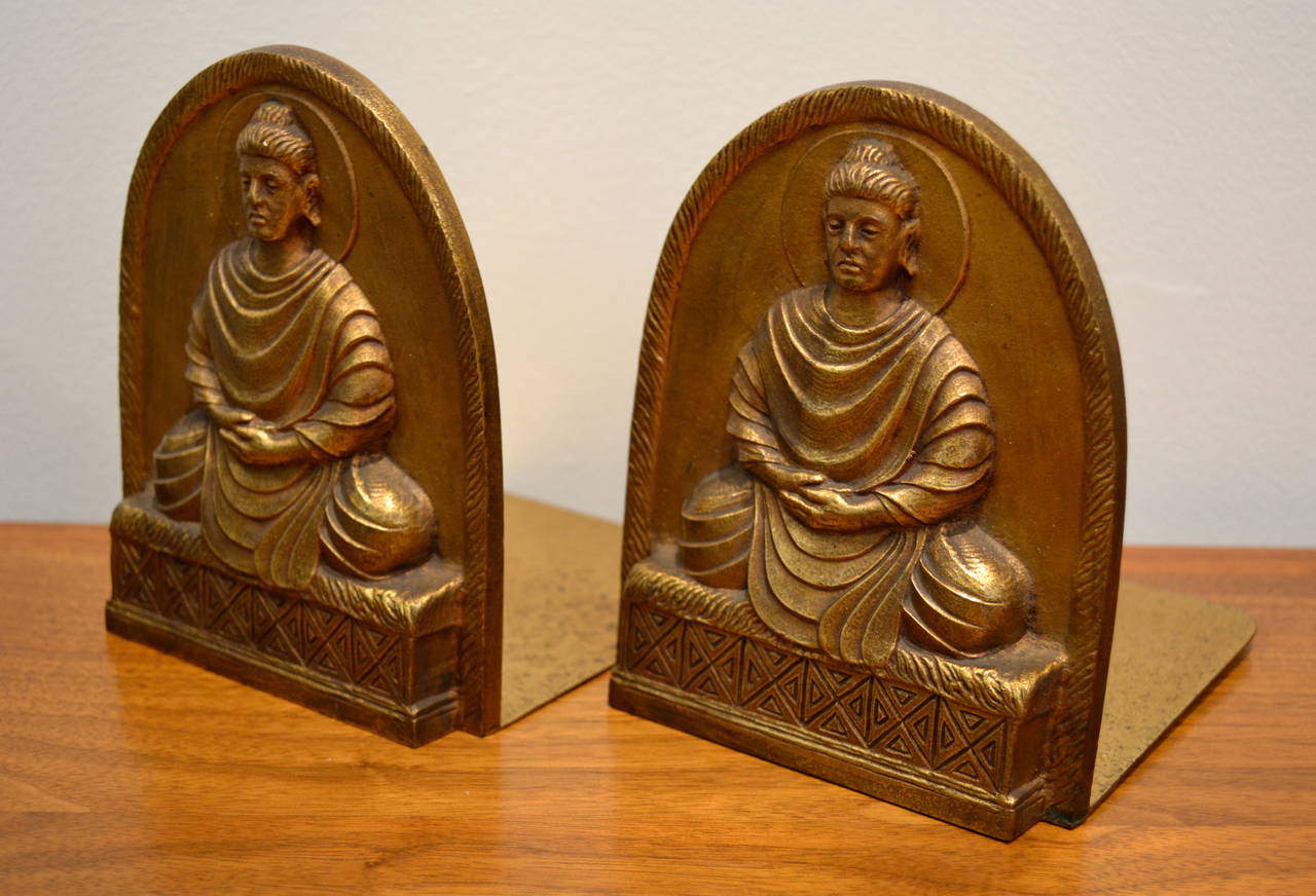 Early 20th century, Tiffany Studios cast bronze Buddha bookends, hallmarked and numbered.