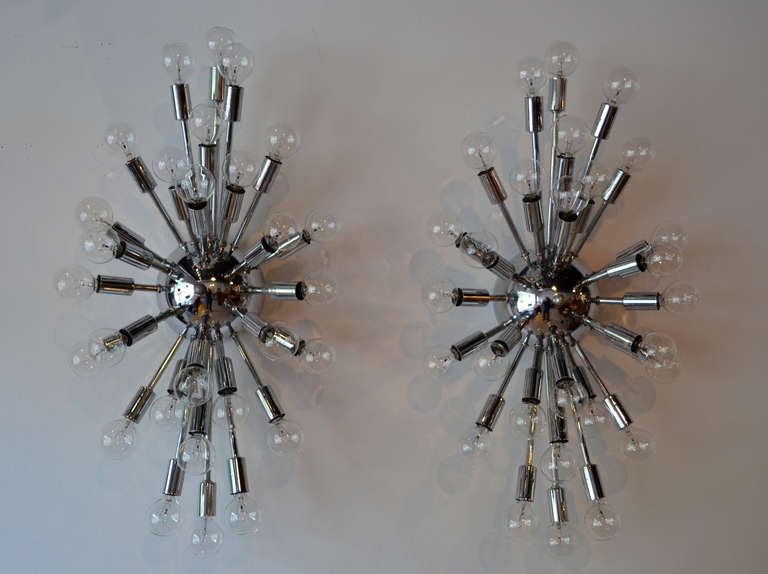 VERY cool and all original! oval chrome Mid-Century Modern sconces, excellent working condition. incredible period piece. Too many spokes to count.