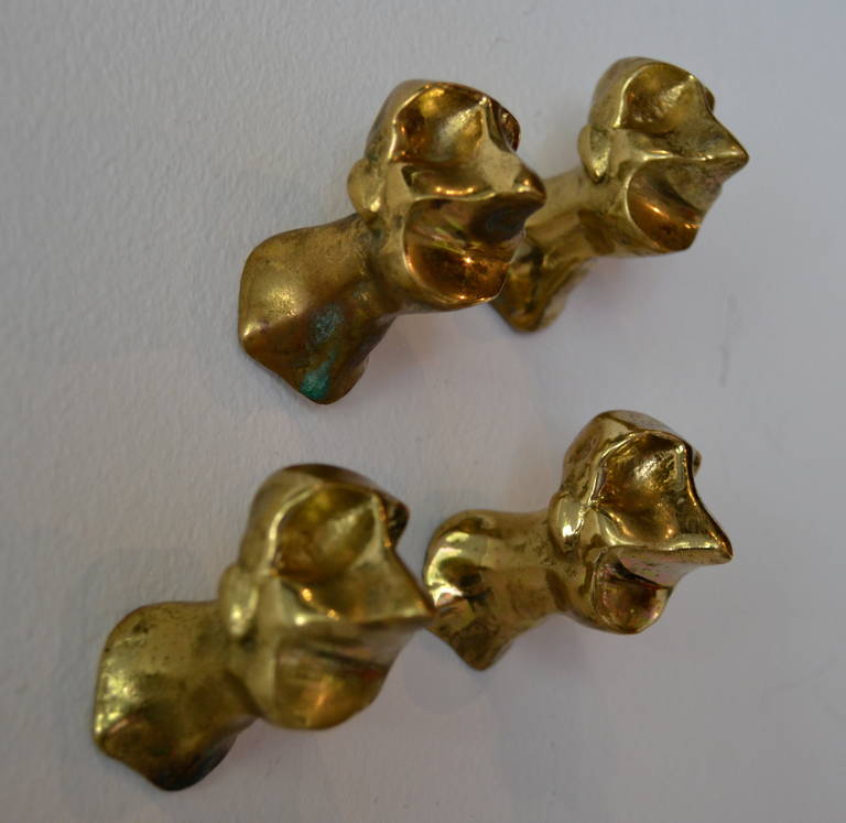 Four bronze brutalist era drawer pulls in the style of Paul Evans, two of the four signed.