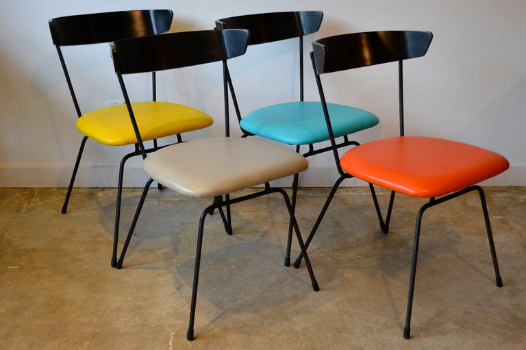 Set of four Clifford Pascoe iron base dining chairs, original vibrant vinyl but replaces plywood seat and padding.