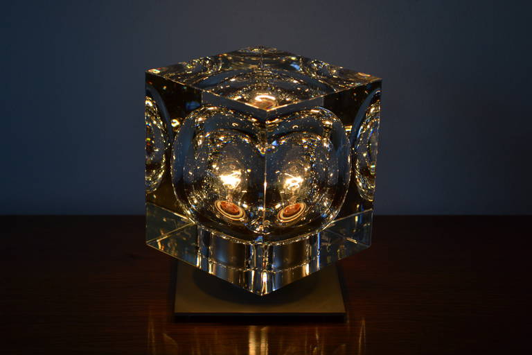 beautiful hollowed crystal cube mounted on brushed metal light socket base, signed.