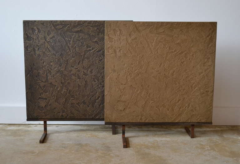 Beautifully Mid Century textured bronze plate sculptures mounted on custom iron stands. Finely crafted and ready to place. Perfect for a mantel, in front of a fireplace, or tabletop. Nice size at approximately 18 x 18 inches square. The different