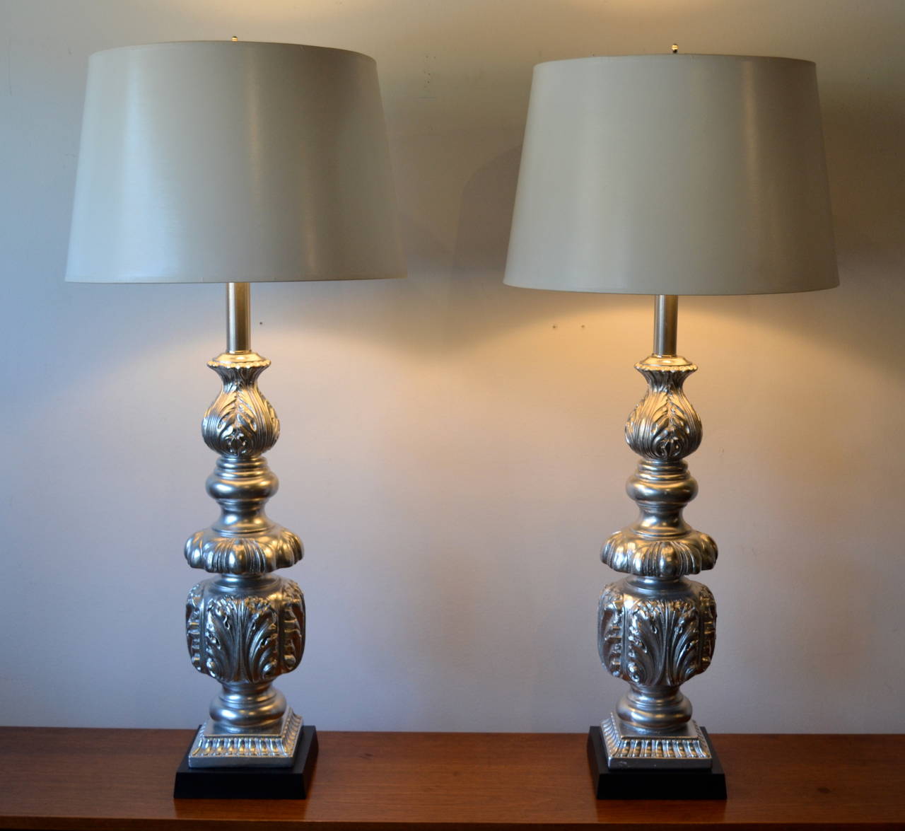 Gorgeous pair of silver Hollywood Regency table lamps. Impressive measures at 30 inches tall! Ornate leaf pattern. Mid-Century Modern, 1960s, restored and rewired.