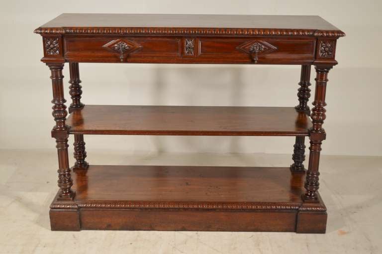 19th-century French dessert buffet made from walnut. Top has a bevelled and gadrooned edge, an apron with two paneled drawers and paneled sides, following down to reeded and turned columns, and supported on a paneled block front base.