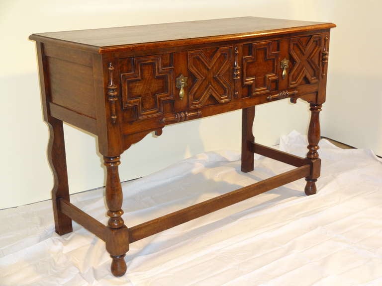 Lovely 19th-C. English Oak geometric sideboard.  Great small size! Two drawers supported on turned legs with joining stretchers. 