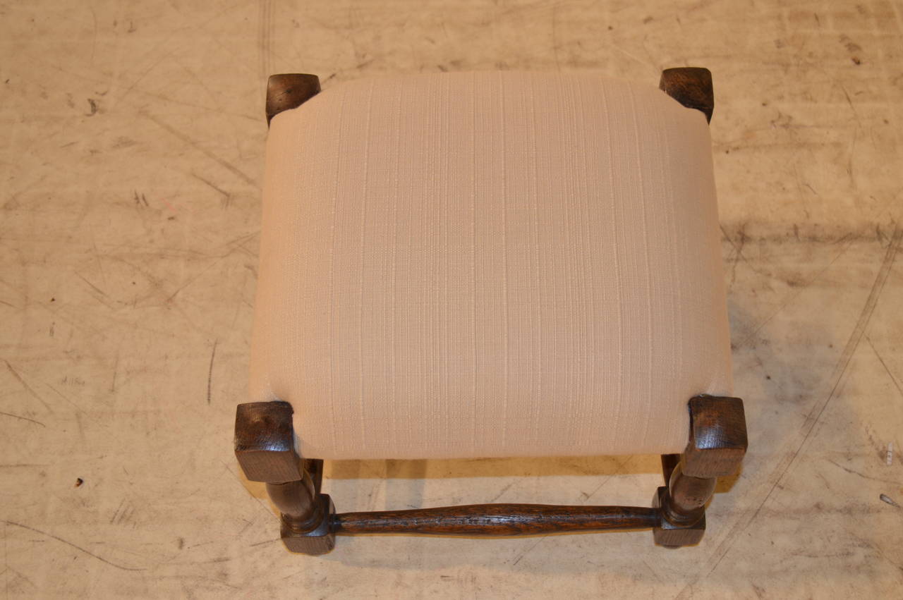 Petite English oak hand turned stool with newly upholstered linen top.  Lovely size.