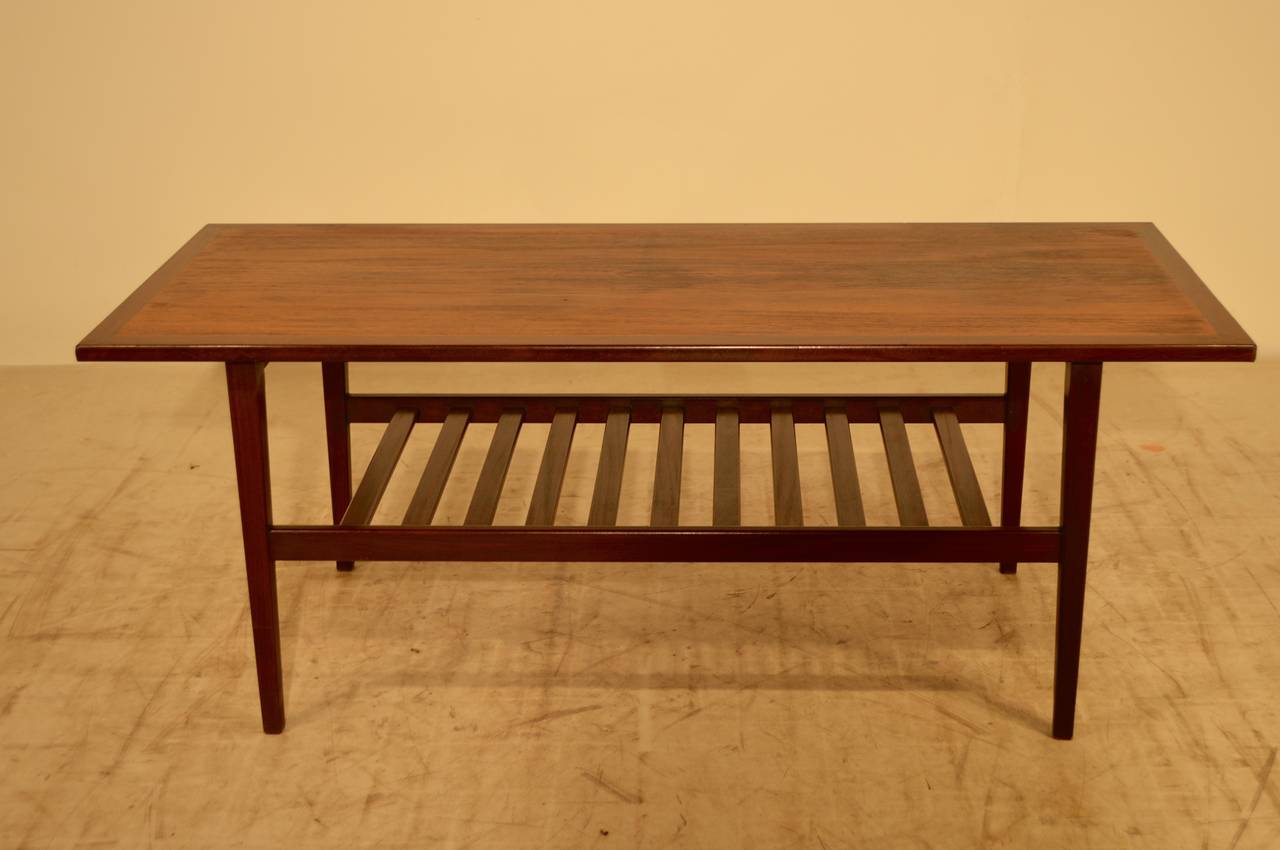G-Plan coffee table with a bi-color wooden top, circa 1960s. Slatted bottom shelf. Wonderfully clean and simple lines.