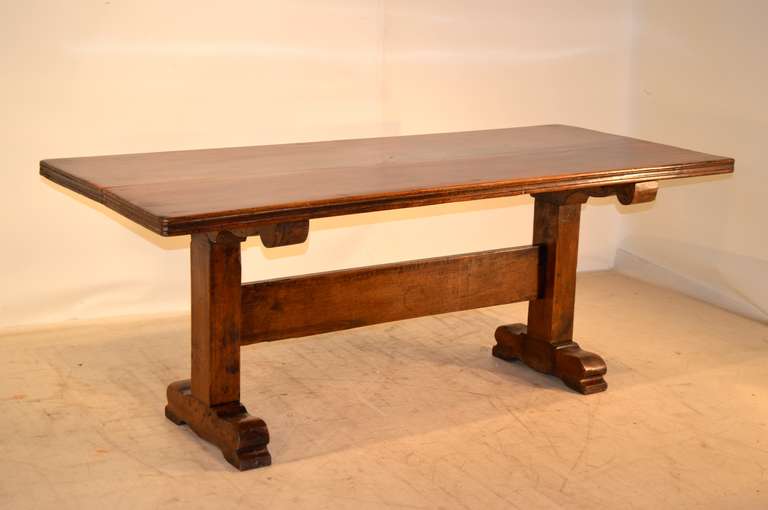 Early 19th century French dining table made from walnut.  The top is 2