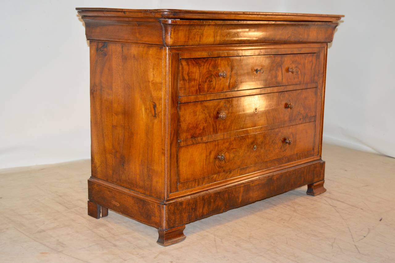 Fantastic 19th-C. French Louis Phillipe commode made from walnut.  The entire piece has gorgeous graining in the wood.  There is a single drawer in the molding at the top, over three drawers, raised on molded bracket feet.