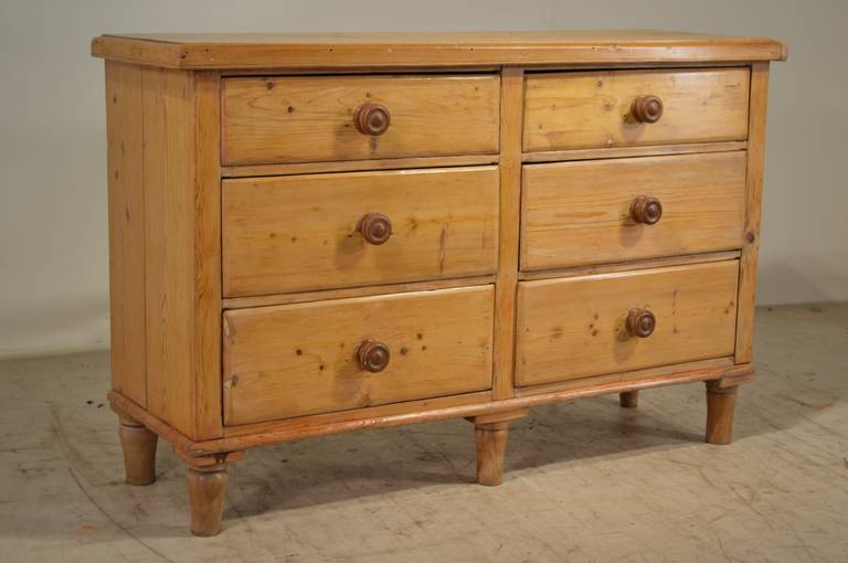 19th-C. English pine dresser with a banded edge around the top following down to six drawers, all raised on tall turned feet.