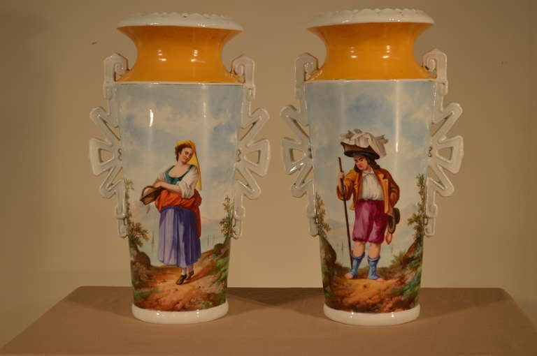 19th-C. Pair of French porcelain vases with lovely hand painted portraits of a peasant man and woman carrying baskets. Wonderfully painted and interesting gold color.