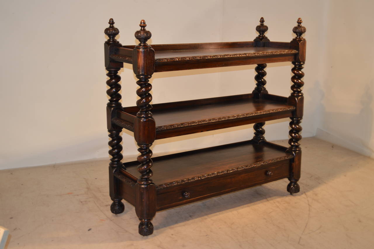 19th-C. English oak dessert buffet with very large barley-twist shelf supports. The server has three shelves, which are gadrooned on the front edges, all over a single drawer. The finials at the top are exquisitely carved and turned, as well as the