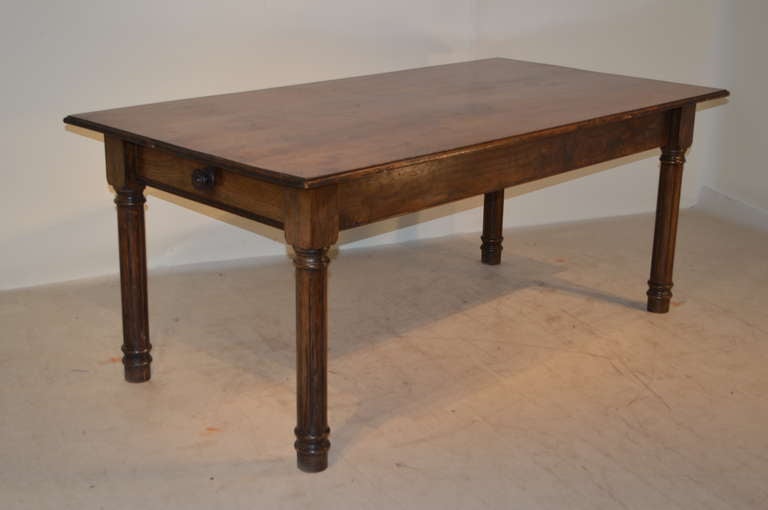19th-C. English farm table with plank top which is beveled around the edges. The apron measures 22.75
