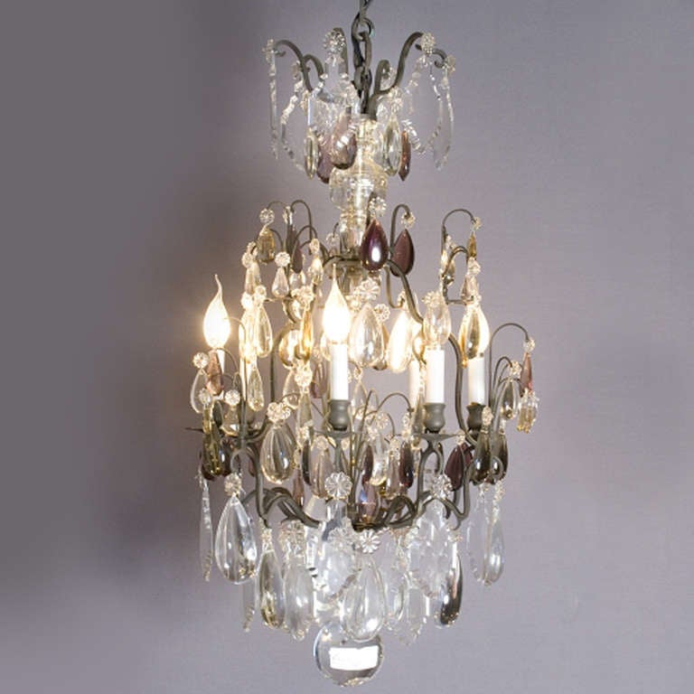 In perfect condition French chandelier with big crystal ornaments and amethyst drops. The framework is made of bronze and has a nice, original, patina. At the bottom hangs a full crystal ball.
Made in France, circa 1820.