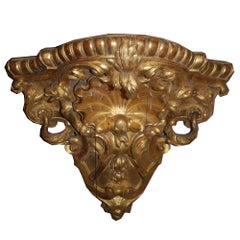 Paire de consoles d'angle en bois doré du XVIIIe siècle