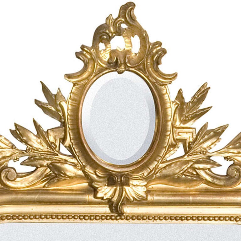 This beautiful piece in gold gilded totally original. Out of the Baroque period, has nice details and a beautiful little mirror in the crown. Made in South France, circa 1860.