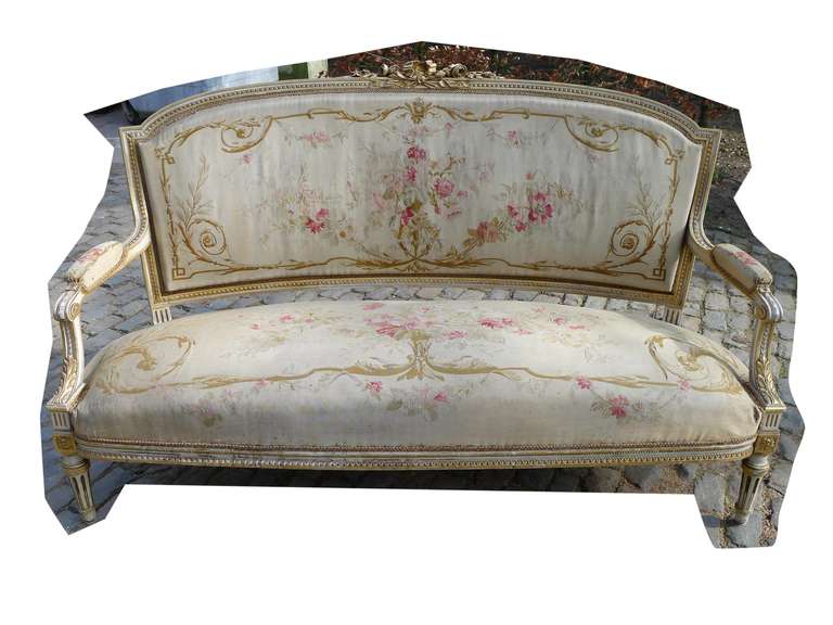Beautiful piece of antiques, this Louis Seize sofa. Rich ornamented wooden frame and original lining of Aubusson fabric. Partially gold gilded frame. Haute époque, 1810. Made in the South of France. In beautiful authentic antique state.
