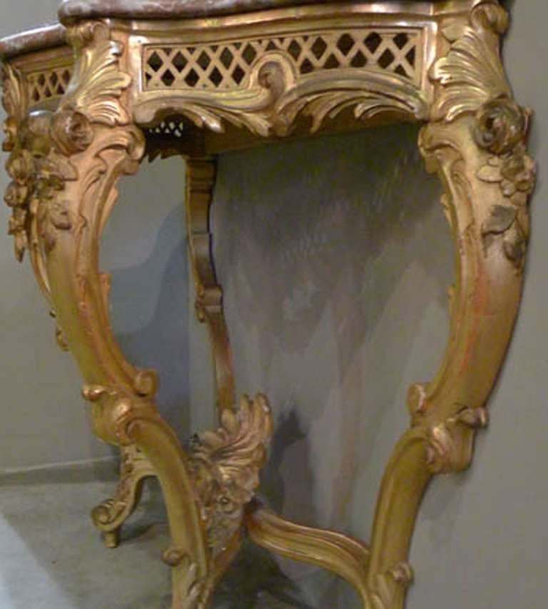 Antique gilded and wood carved console table with original marble top. Baroque.
Originates France, dating circa 1860.