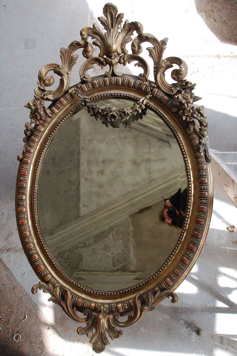 Beautiful and richly ornamented oval mirror.
Originates France, dating, circa 1850.