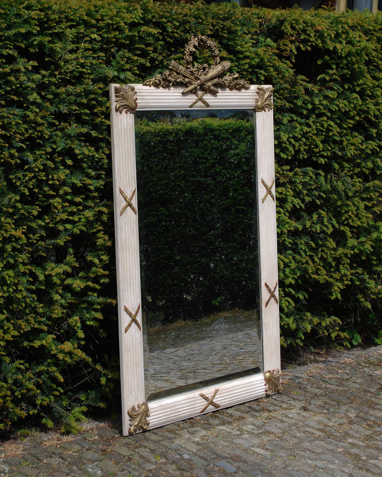 20th century French mirror.
Original glass.
Off-white color with gold gilded top and accents.
Originates France, dating circa 1910.