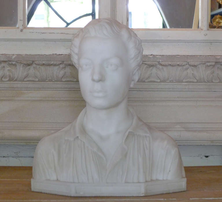 This nicely cut marble bust is made, circa 1920 in France. It is very detailed and made of beautiful white marble. Portrait of a young wealthy man.